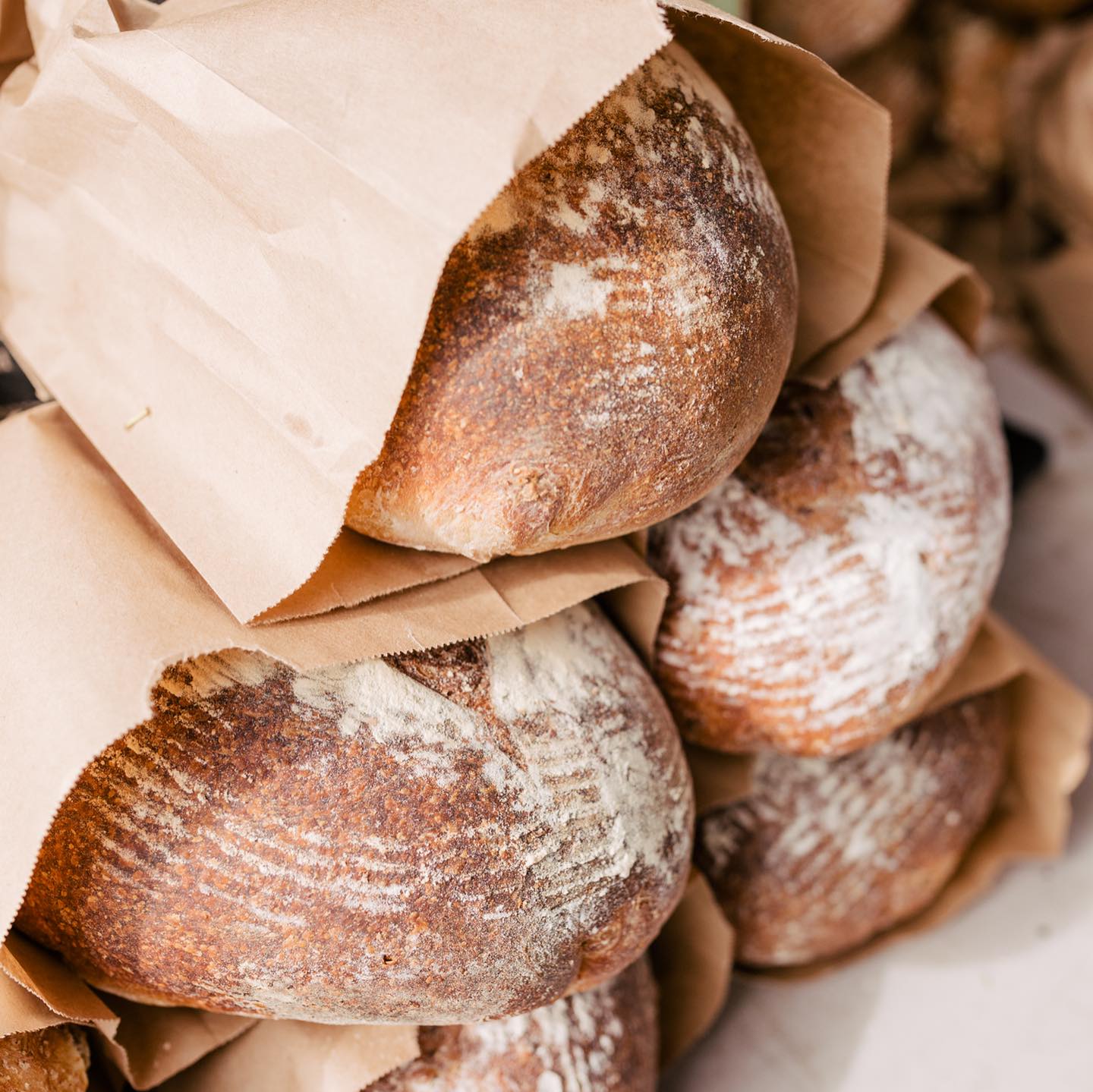 Loaves of fresh baked bread in paper bags at the Qualicum Beach Farmers Market.